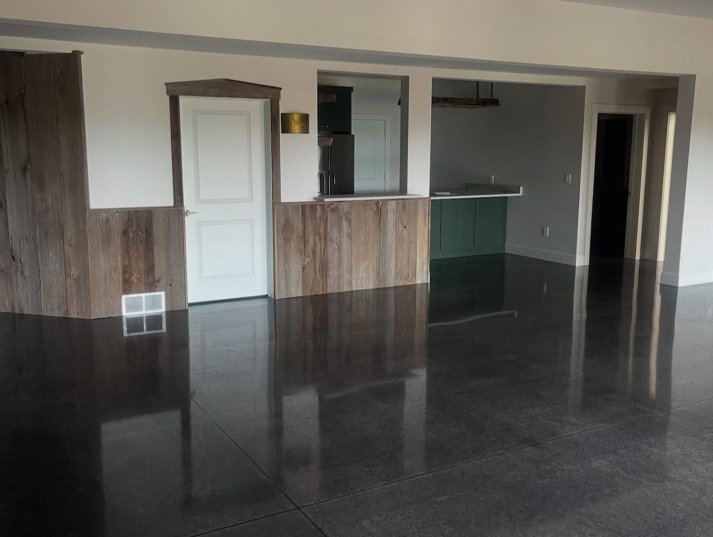 Black dyed and polished concrete floor by 814 Epoxy and More in Erie, PA