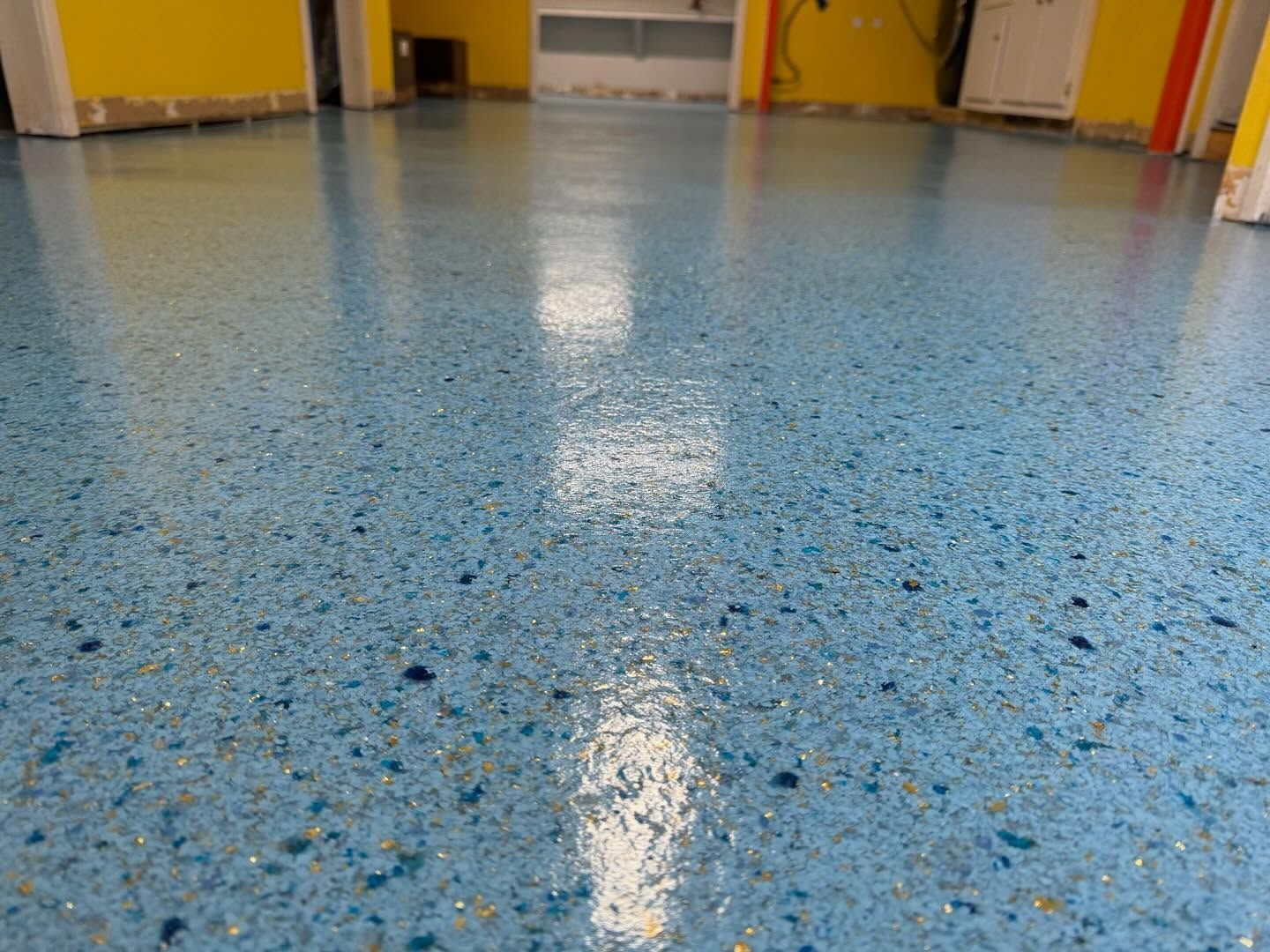 Custom flake epoxy blue and grey floor in commercial space Erie PA 814 Epoxy