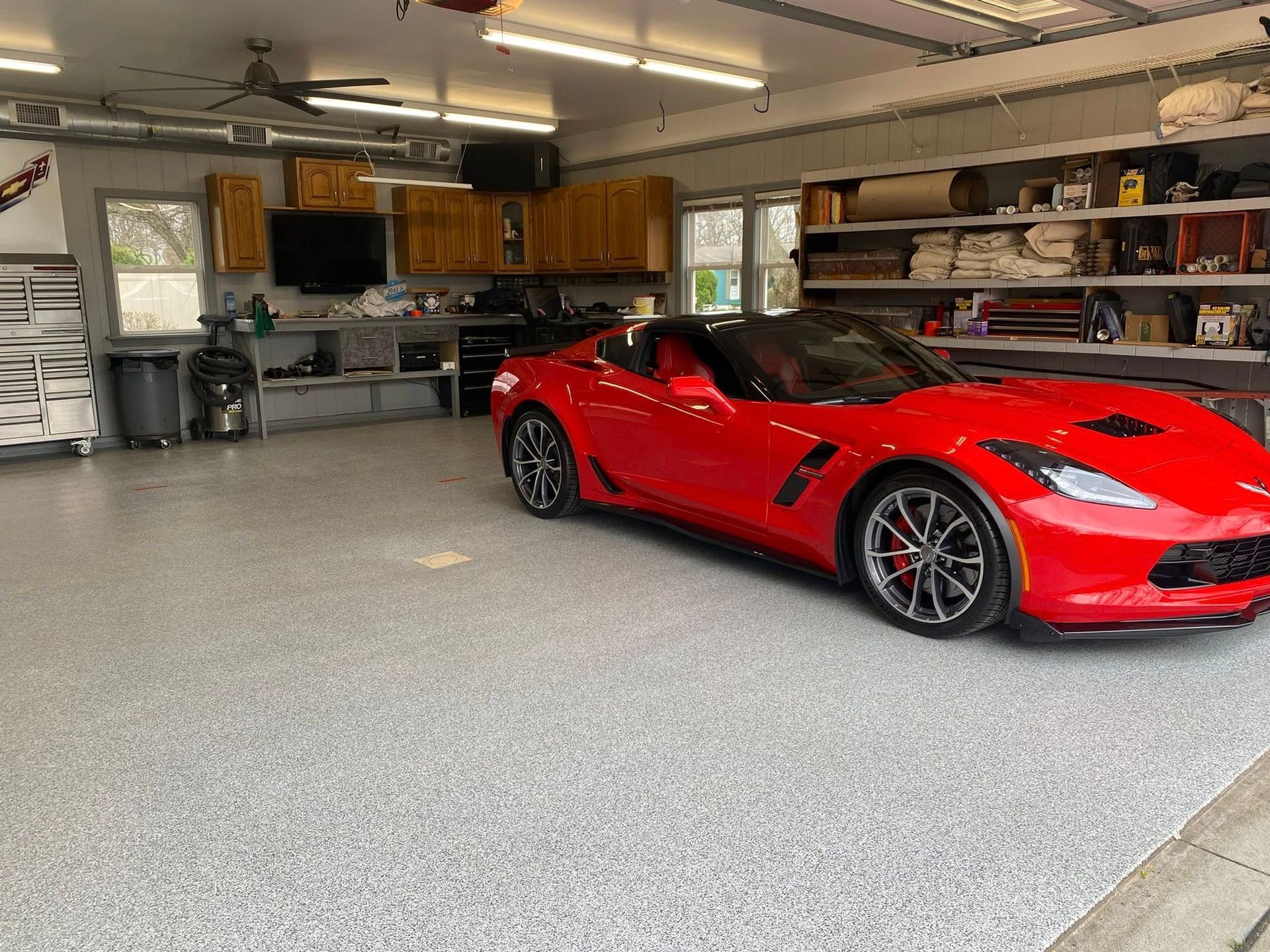 Sports car parked on a flake epoxy garage floor by 814 Epoxy and More in Erie, PA