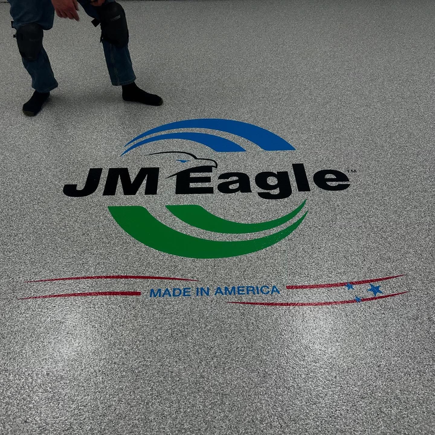 Epoxy flake shop floor with custom logo by 814 Epoxy and More