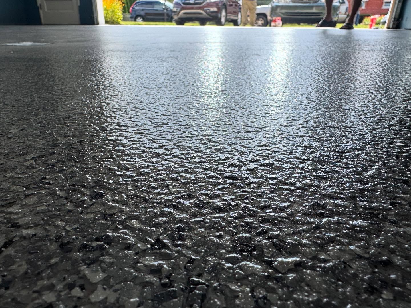 Epoxy flake garage floor closeup by 814 Epoxy Erie PA - free quotes available