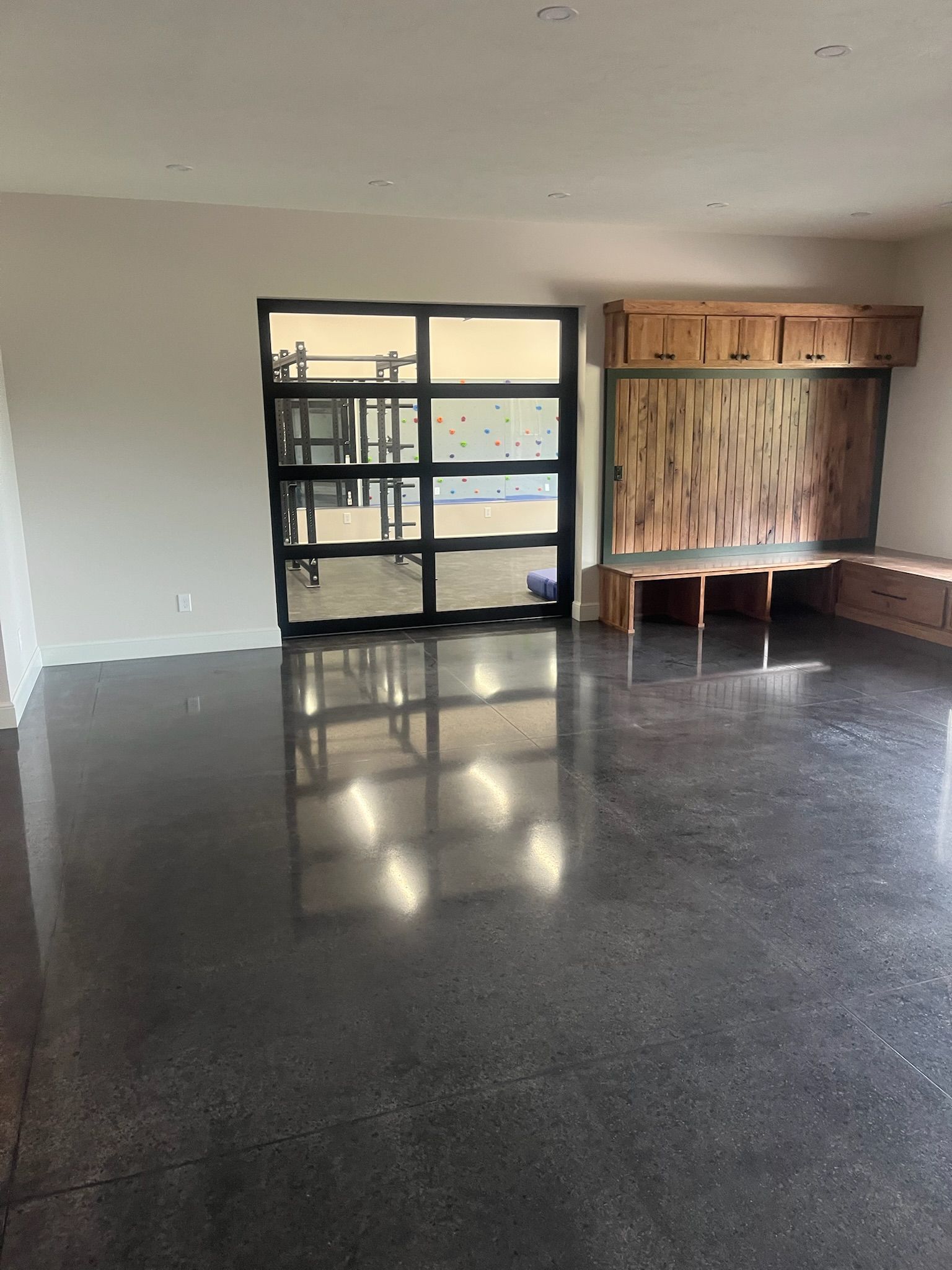 Dyed polished concrete living room floor with natural light Erie PA 814 Epoxy