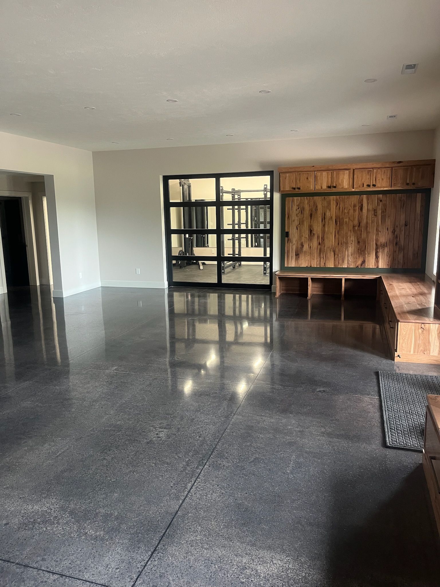 Dyed polished concrete floor in home with barn doors Erie PA 814 Epoxy
