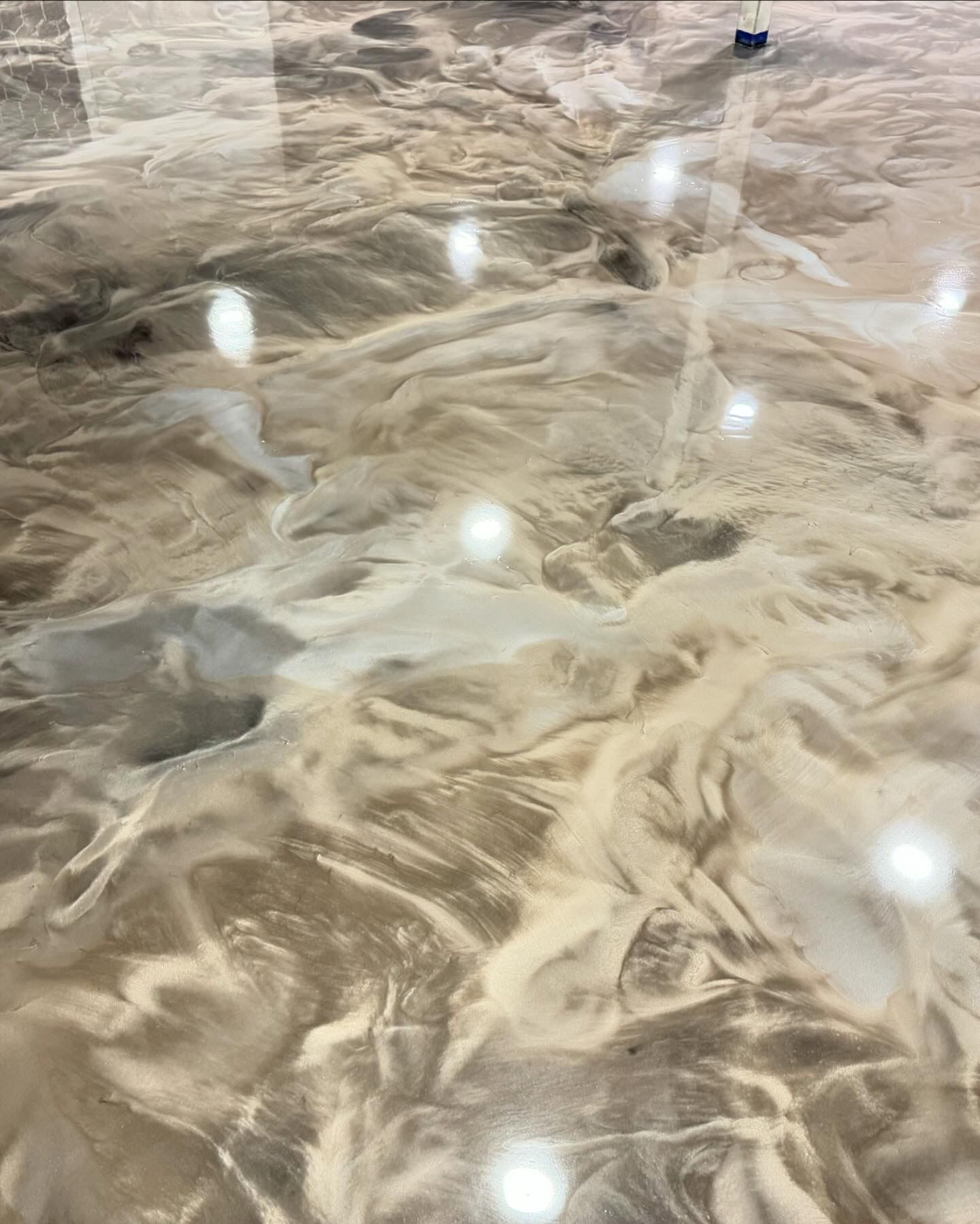 Glossy metallic epoxy floor finish by 814 Epoxy and More in Erie, PA