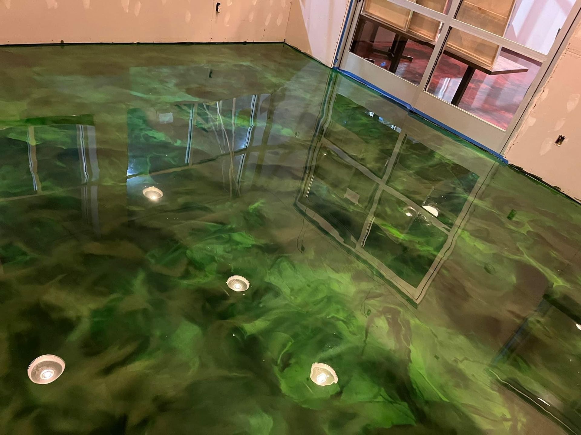 Green and blue metallic epoxy floor overhead view 814 Epoxy Erie PA