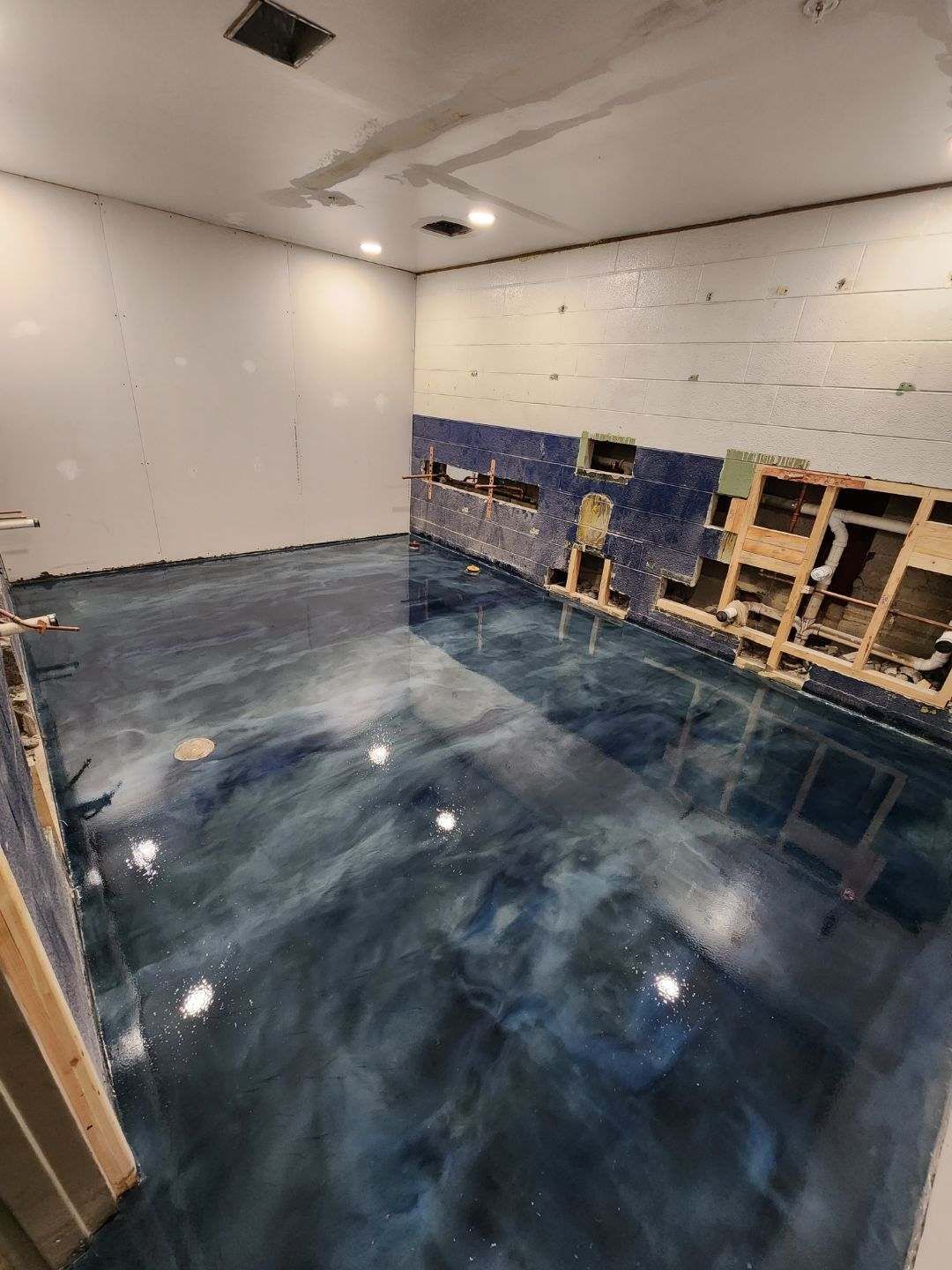 Metallic epoxy floor in progress before and after Erie PA garage 814 Epoxy