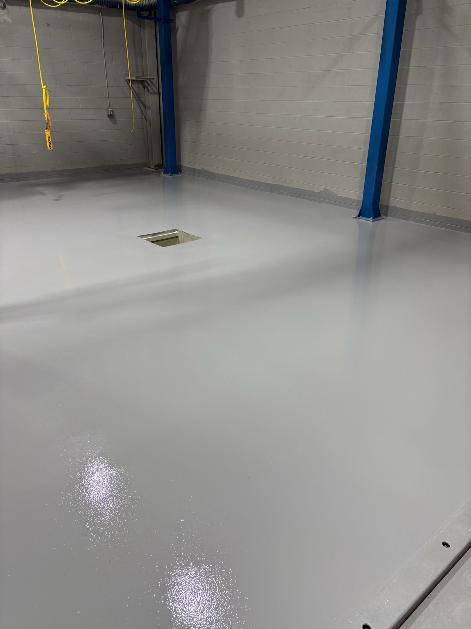 White chemical containment coating with secondary containment walls Erie PA