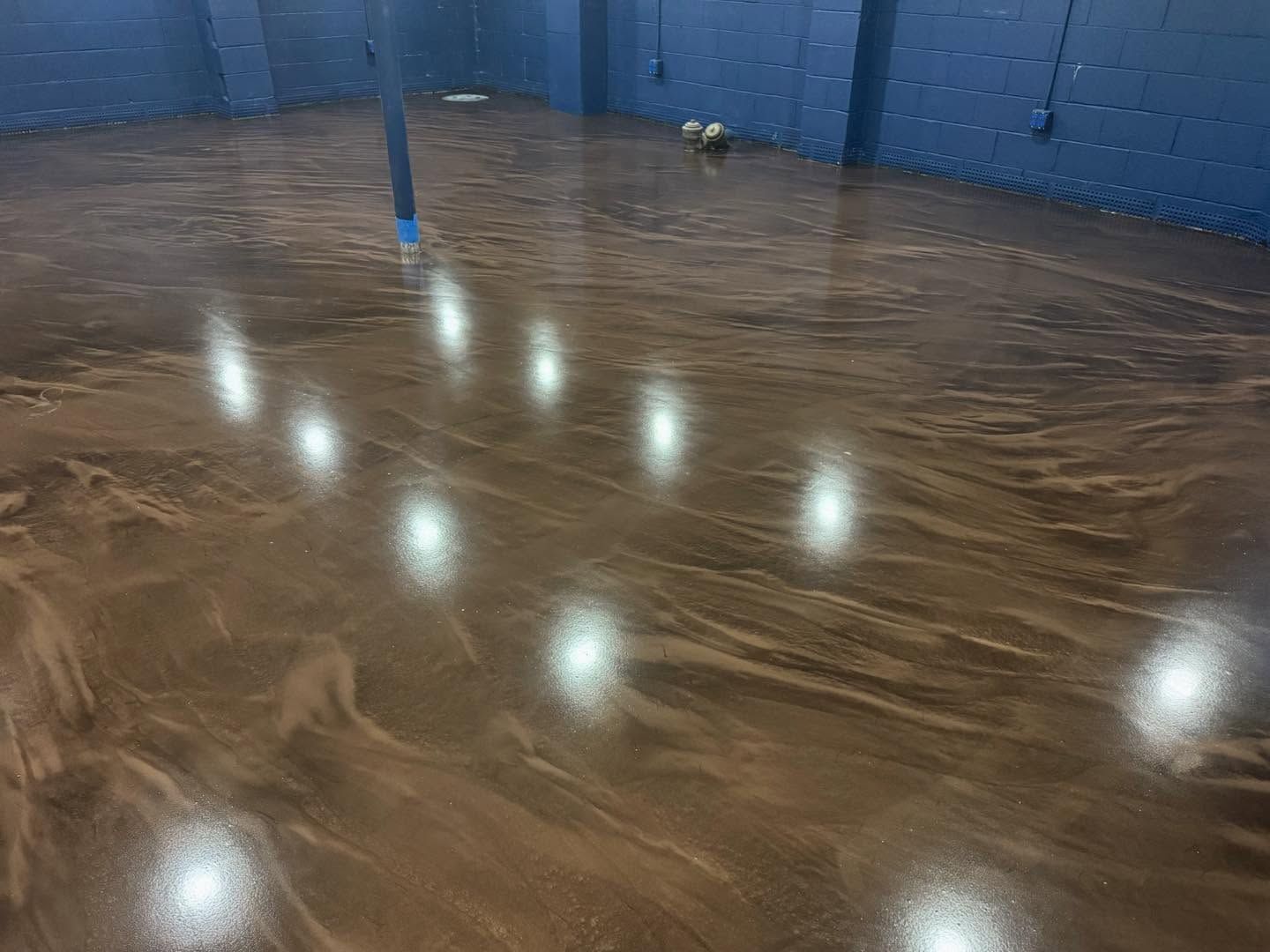 Finished metallic epoxy basement floor with mirror-like shine in Erie, PA