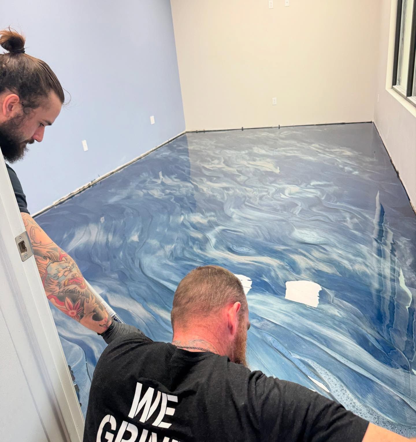 Metallic epoxy office floor with custom decorative finish by 814 Epoxy and More