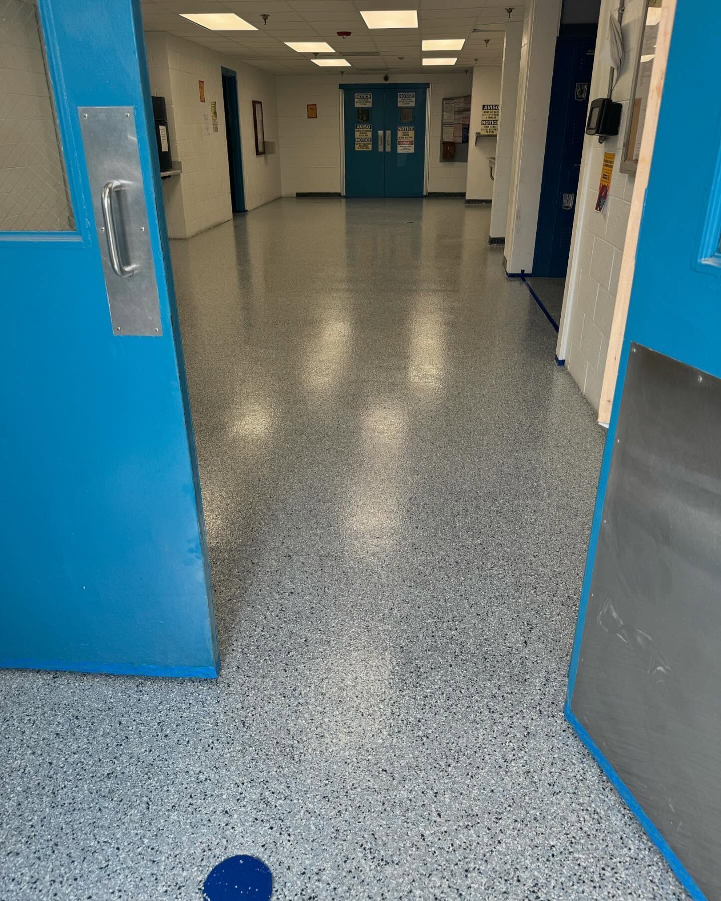 Rapids color epoxy flake commercial floor with blue accent wall Erie PA