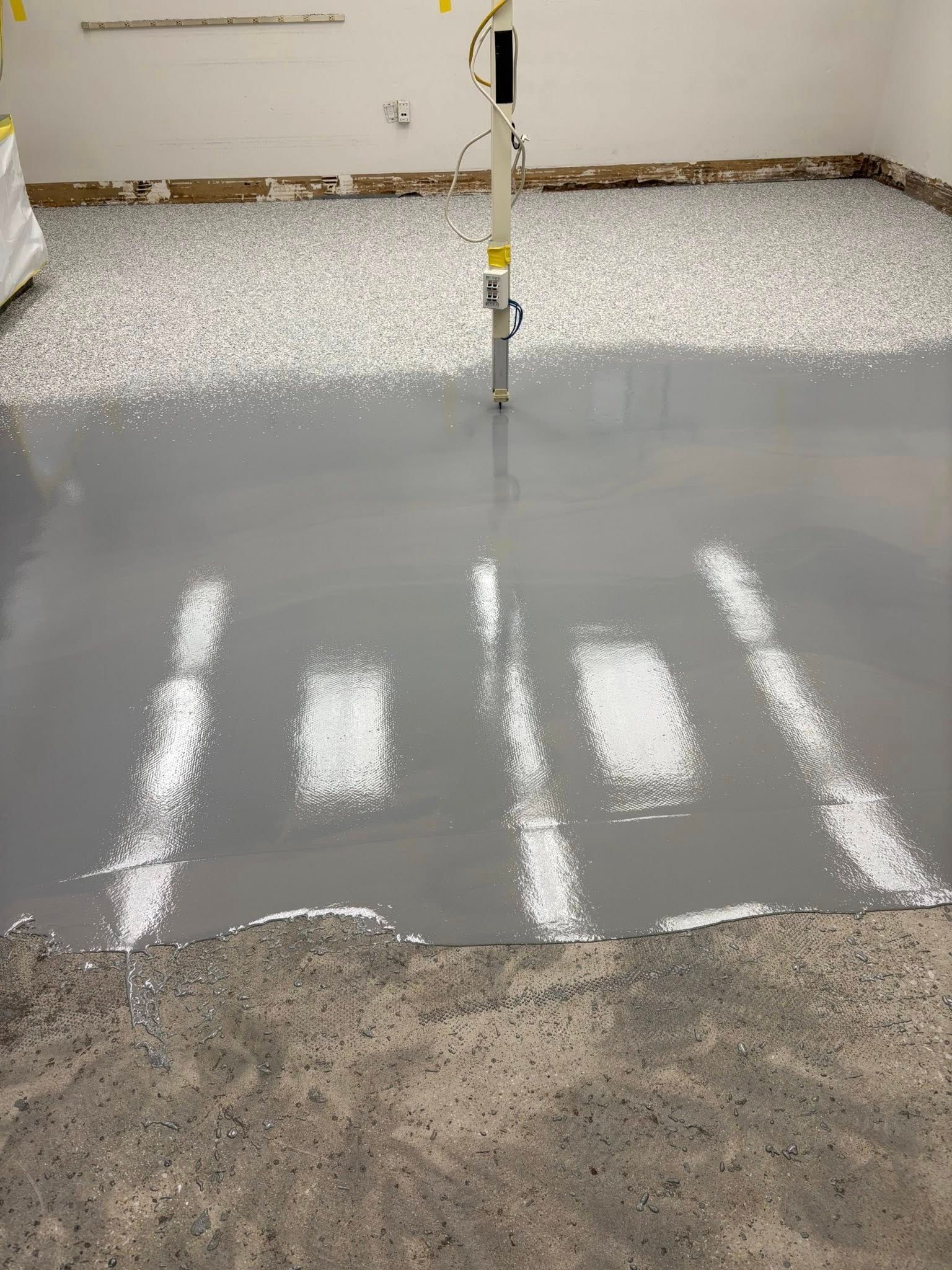 Urethane cement floor coating with drain in industrial facility Erie PA