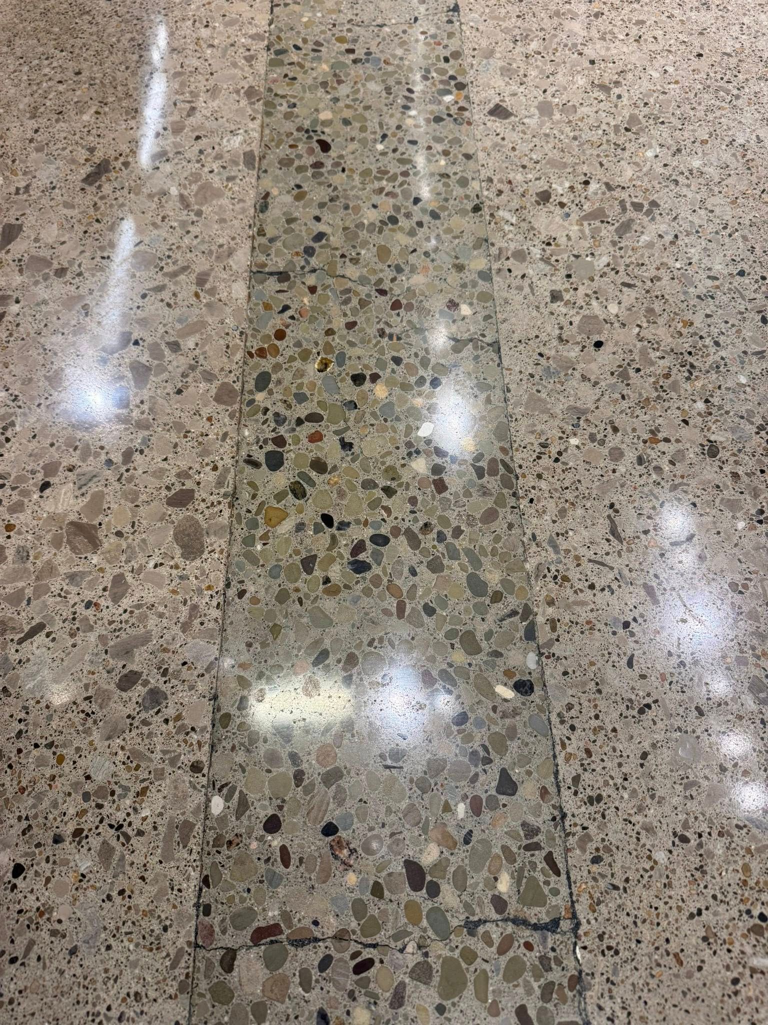 Aero aggregate exposed in a polished concrete floor by 814 Epoxy and More