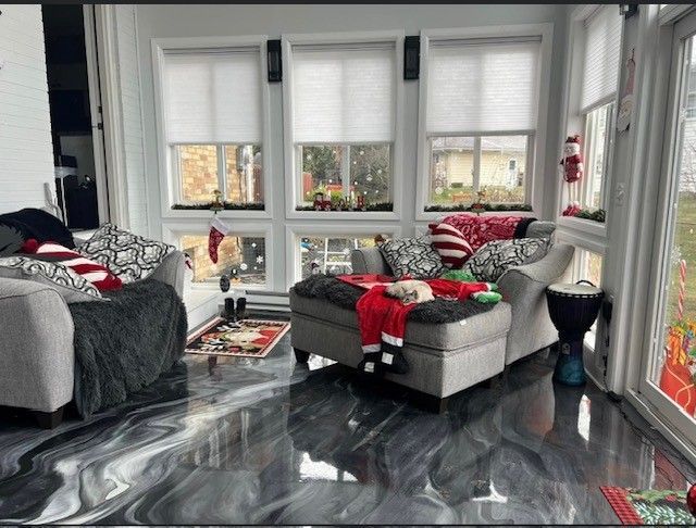 Metallic epoxy living room floor transformation by 814 Epoxy Erie PA