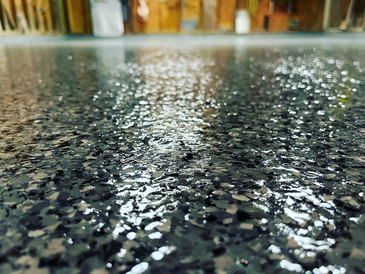 Close-up texture of an epoxy flake floor coating in Erie, PA