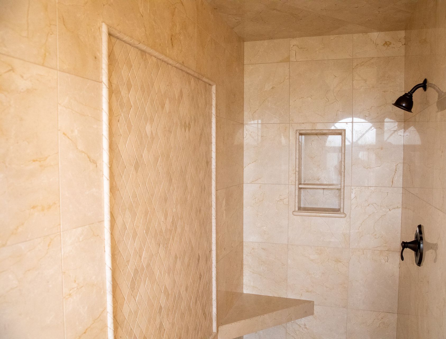 A toilet is sitting on a wooden floor next to a bathtub.