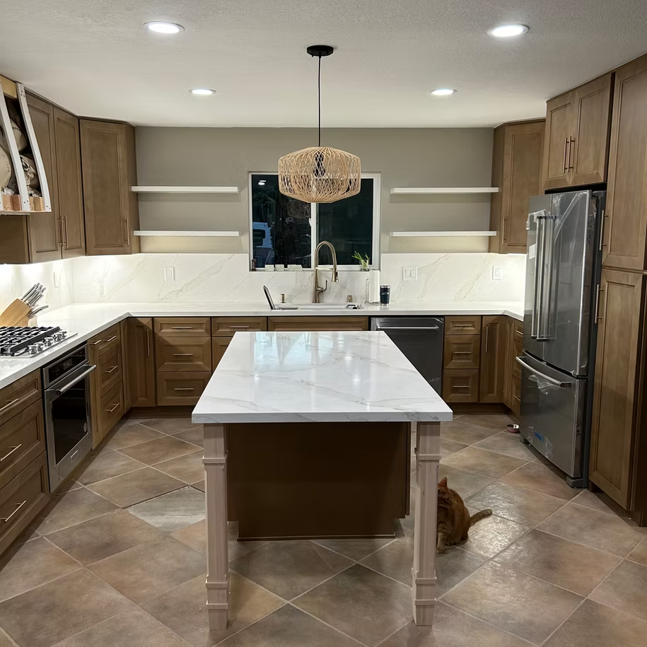 A remodeled kitchen with a large island.