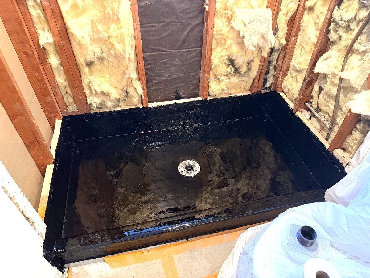 Properly waterproofed hot mop shower pan installed by Center Home Improvement