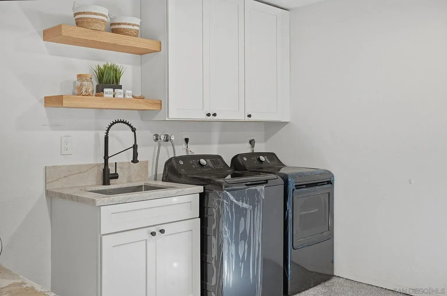 2644 La Costa whole home remodel by Center Home Improvement - utility room with washer dryer
