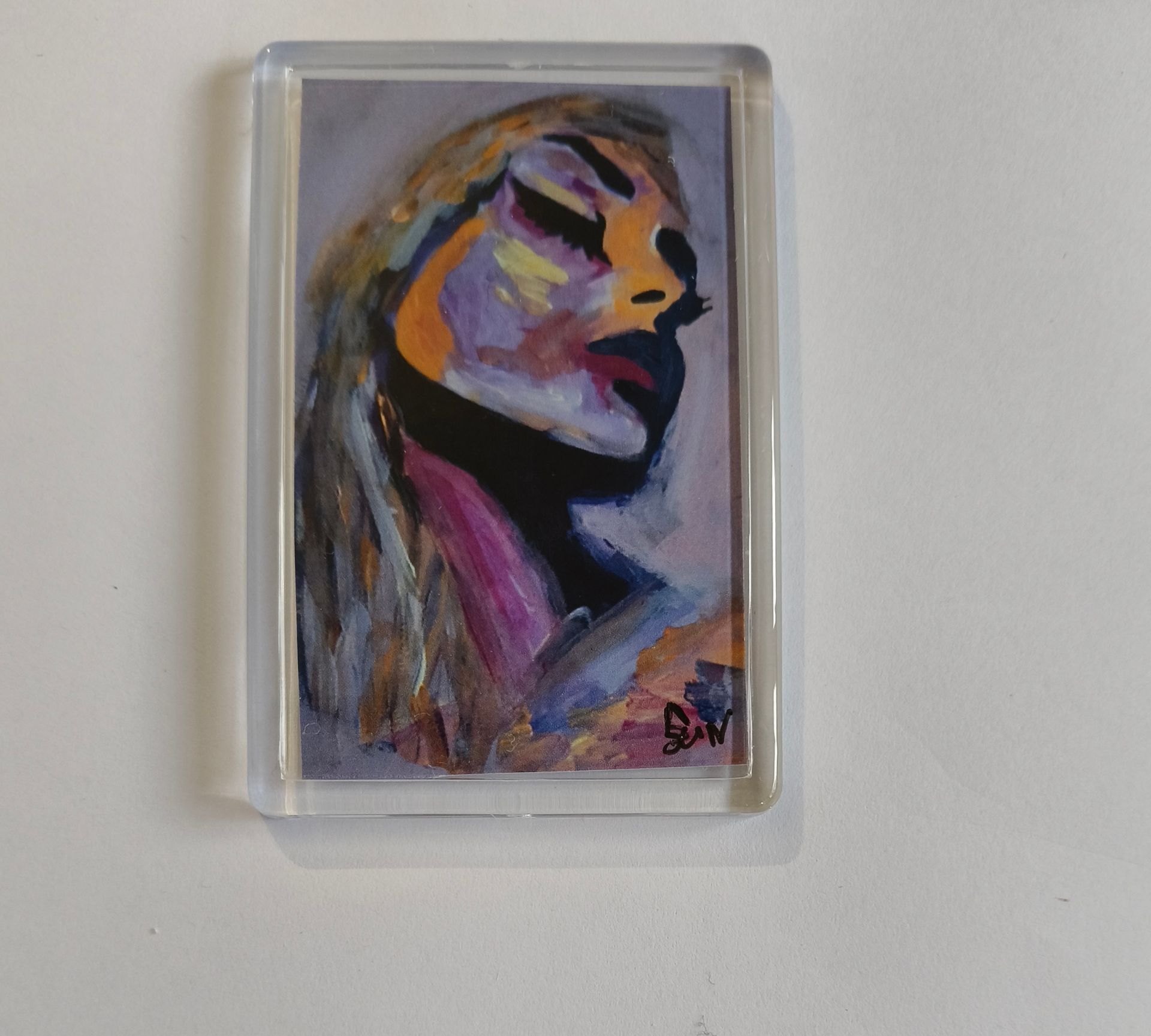 magneet van een expressief, impressionistisch schilderij van een gezicht in profiel, weergegeven met krachtige penseelstreken