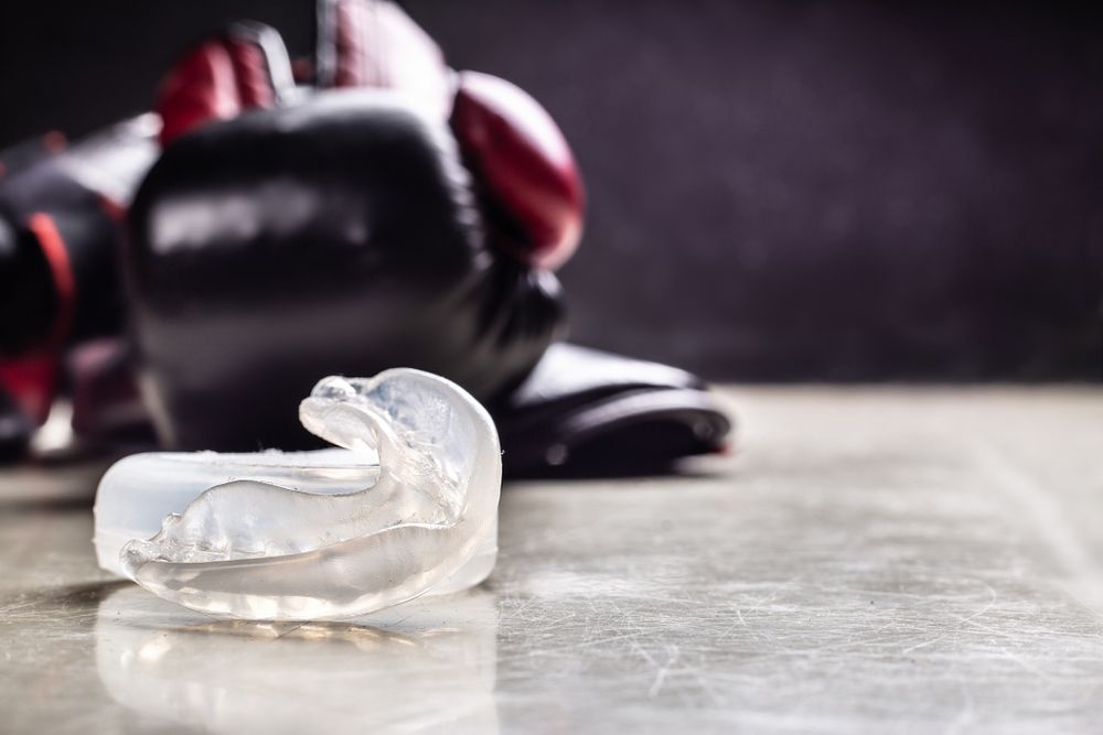 Sports Mouthguard And Boxing Gloves — Dental Services in Berserker, QLD