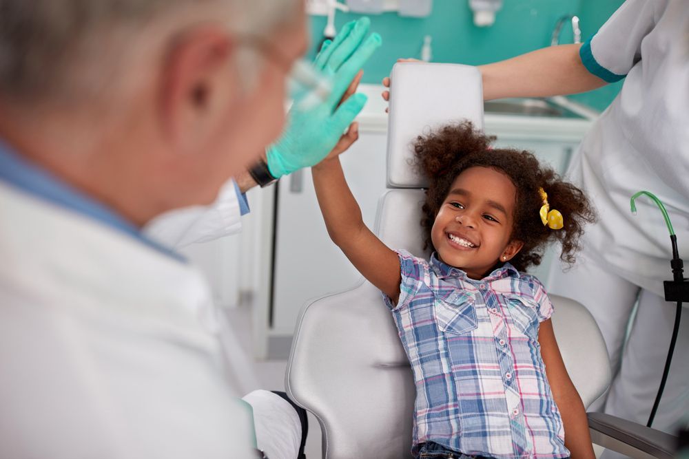Patient With The Dentist — Dental Services in Berserker, QLD