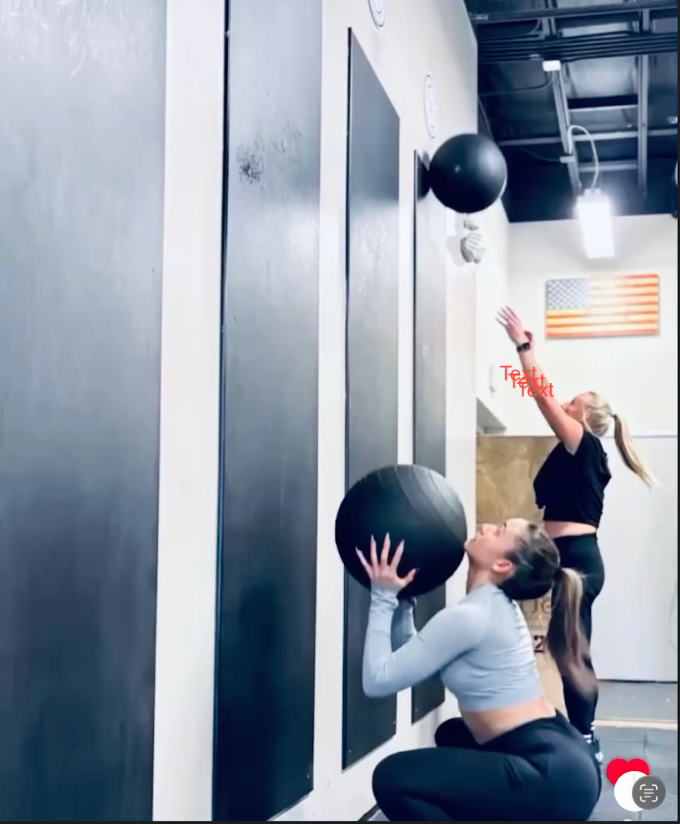 Person exercising with a green suspension trainer against a wall in a gym
