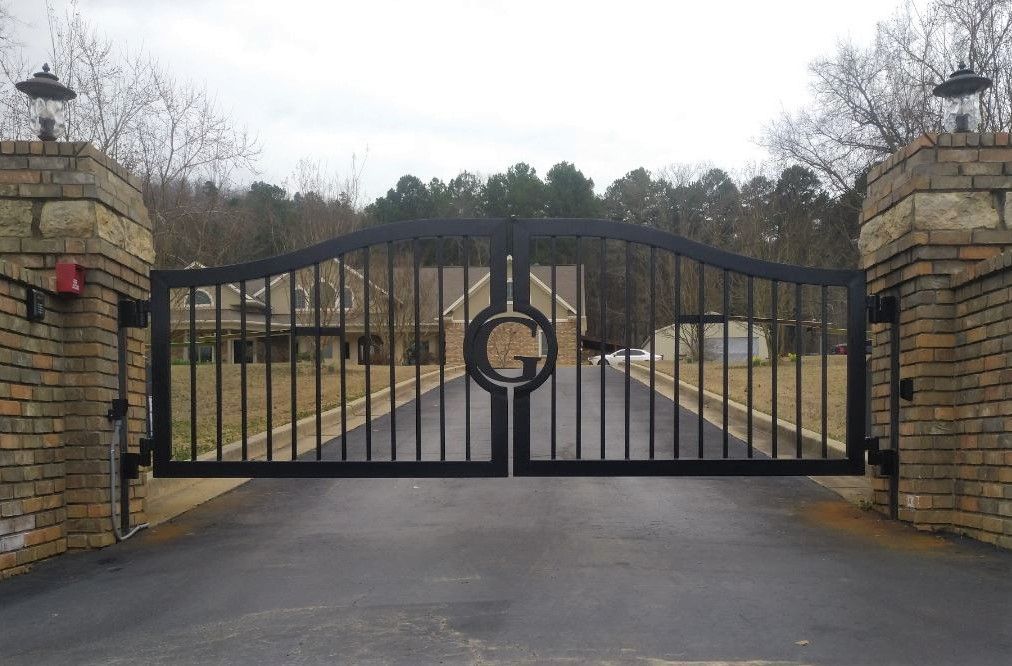Black metal gate with a large 