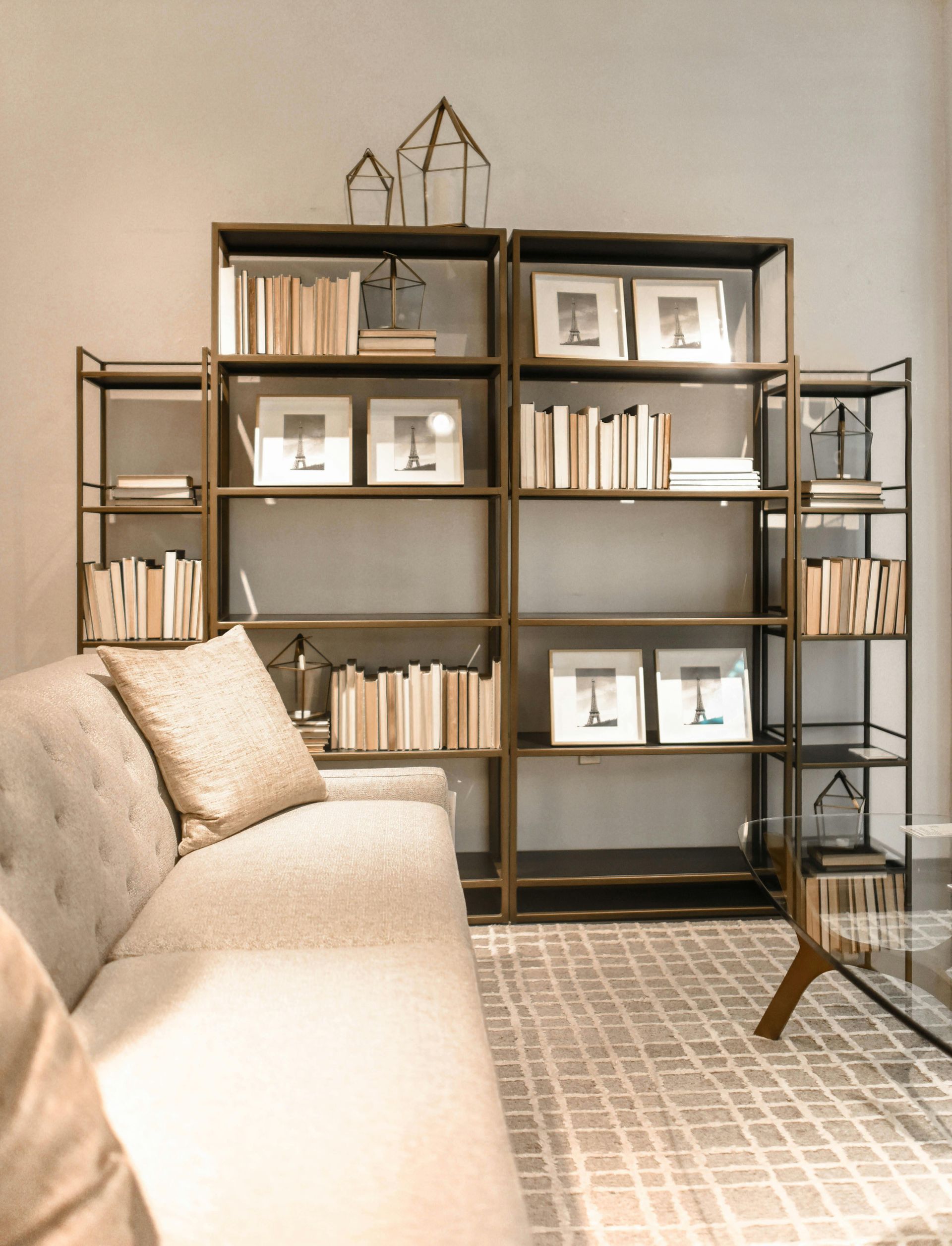 A living room with a couch and bookshelves with the letter l on them