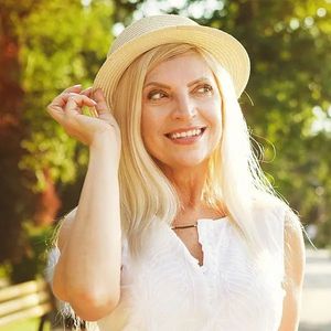 Periodontics - smiling woman with hat