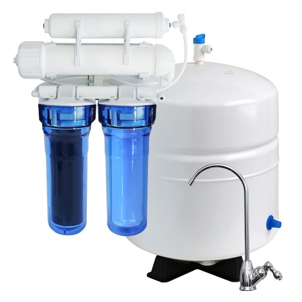 Water softener system against a brick wall, with a salt tank and two black tanks.