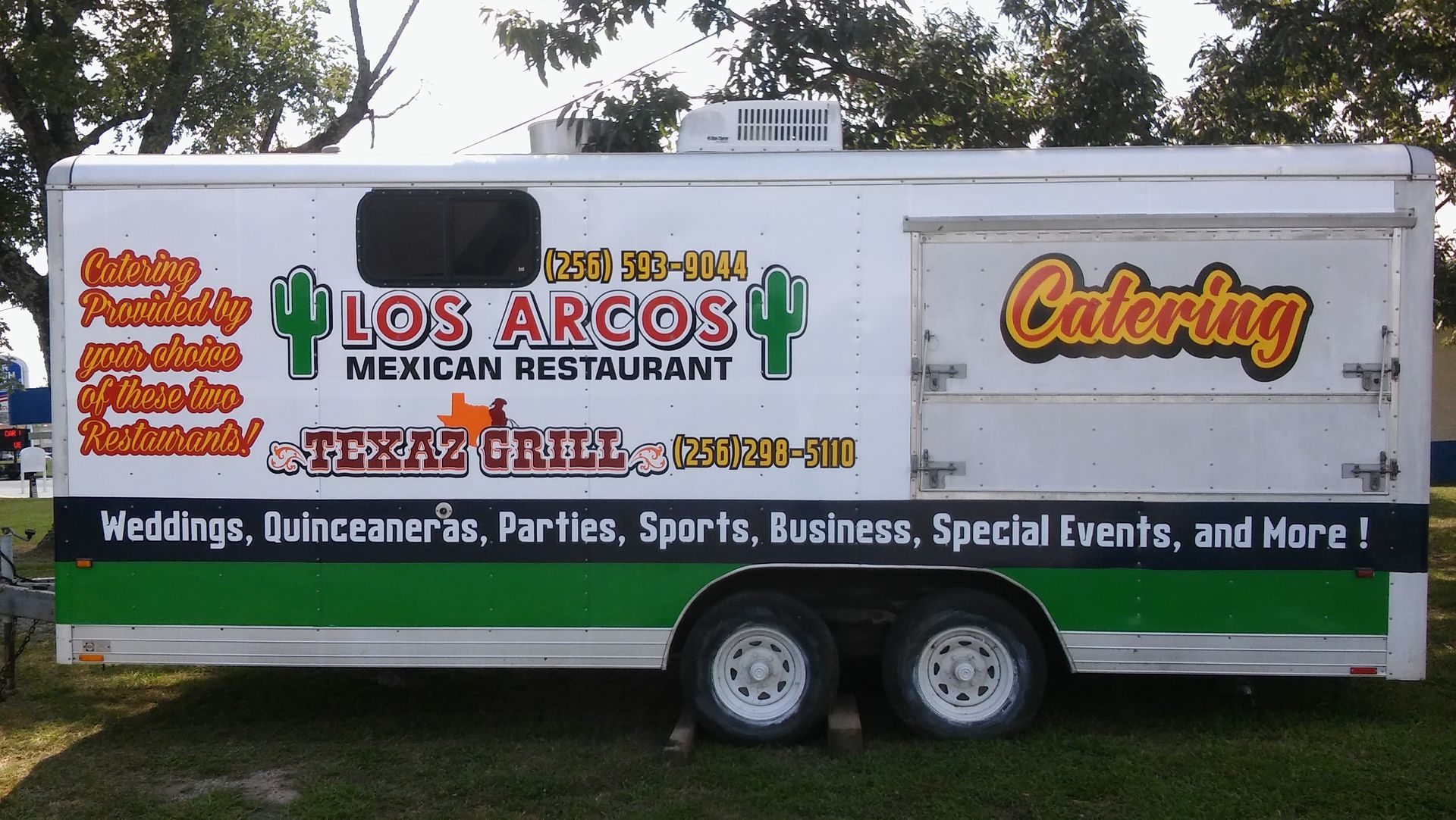 A los arcos mexican restaurant trailer is parked in the grass