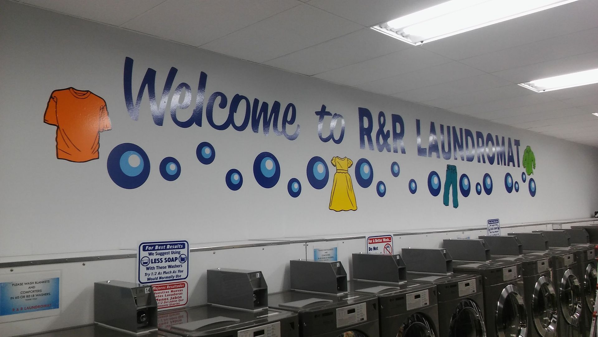 A laundromat with a sign that says welcome to r & p laundromat
