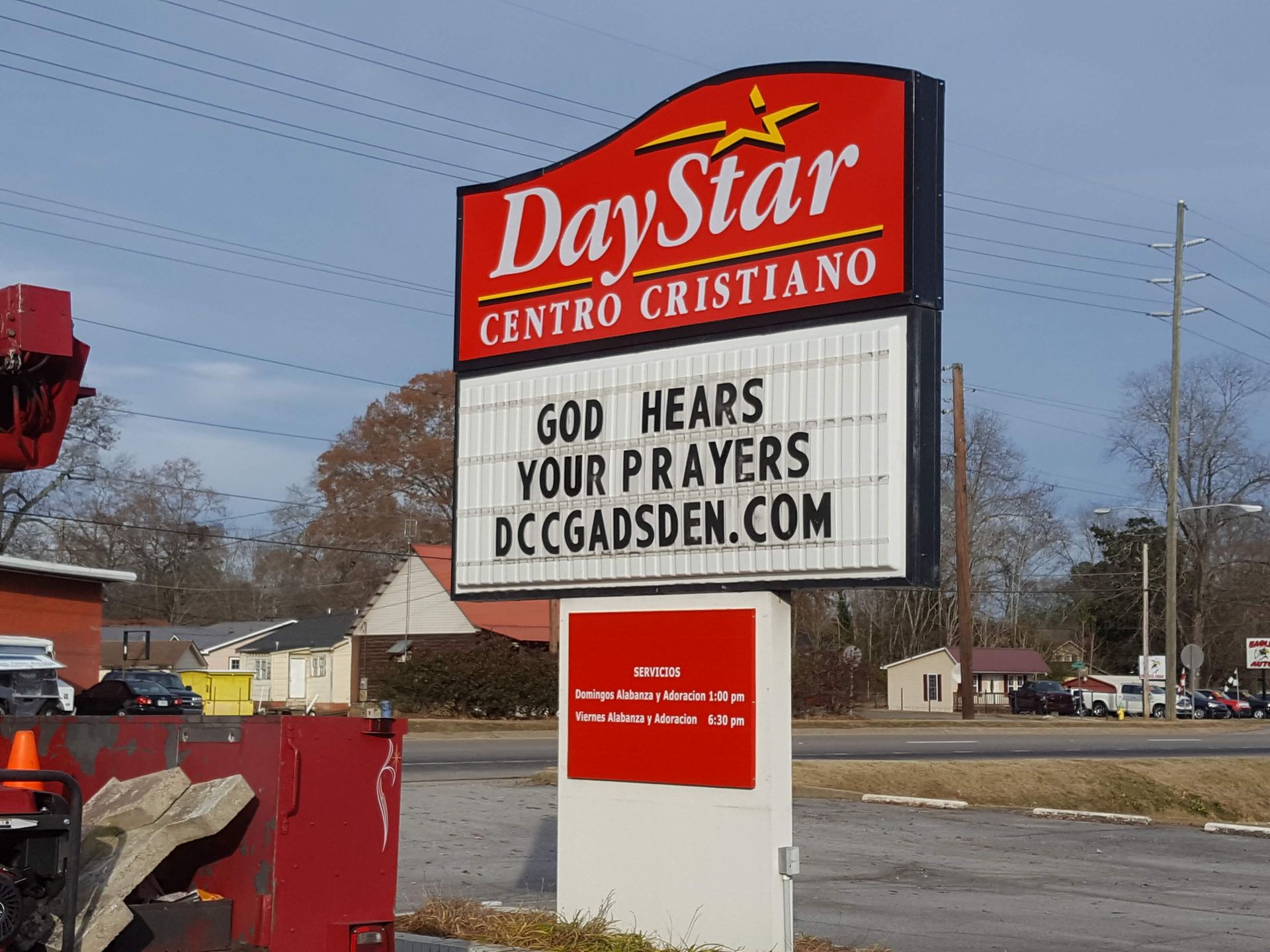 A day star centro cristiano sign that says god hears your prayers