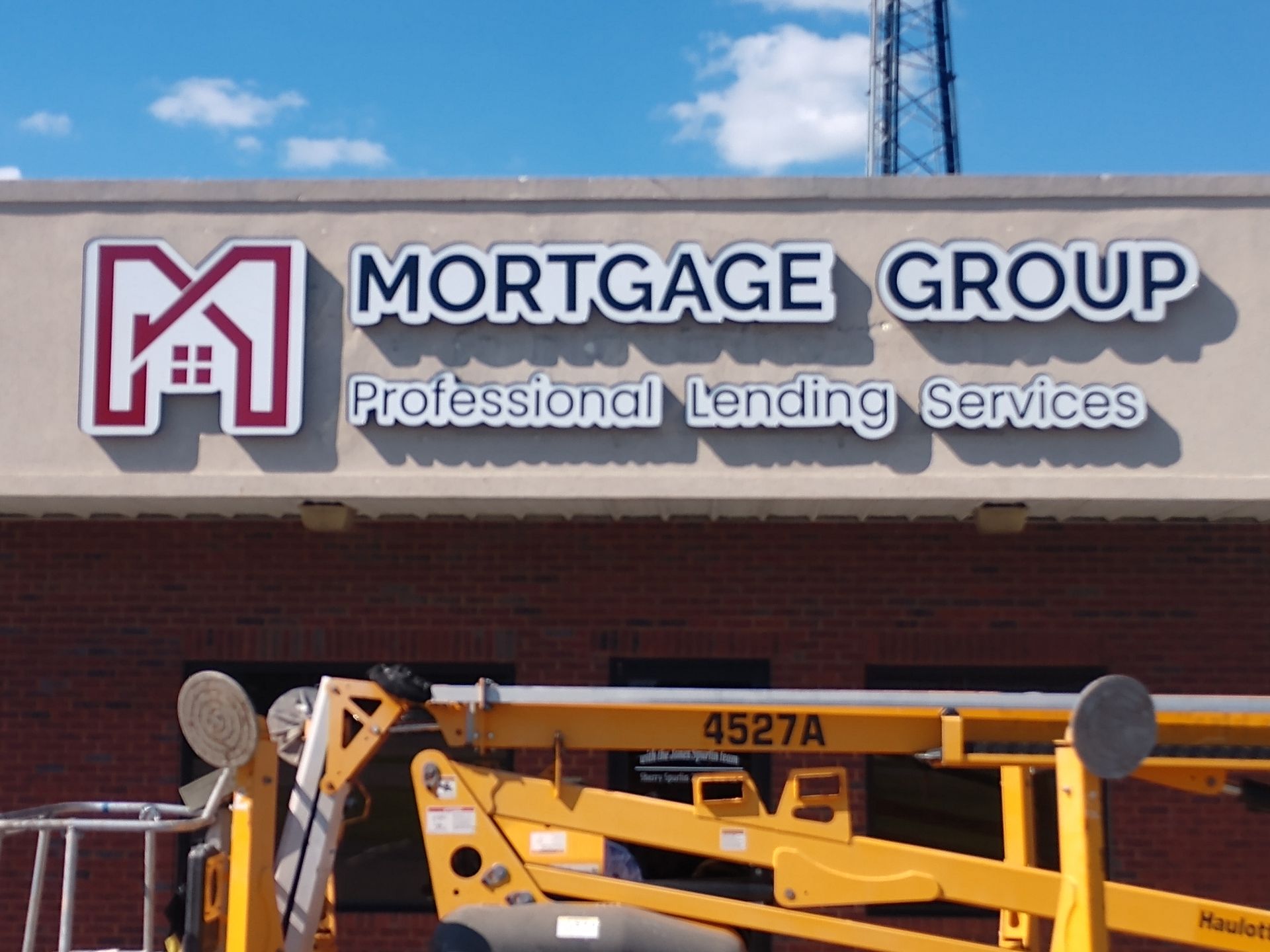 A sign that says mortgage group professional lending services