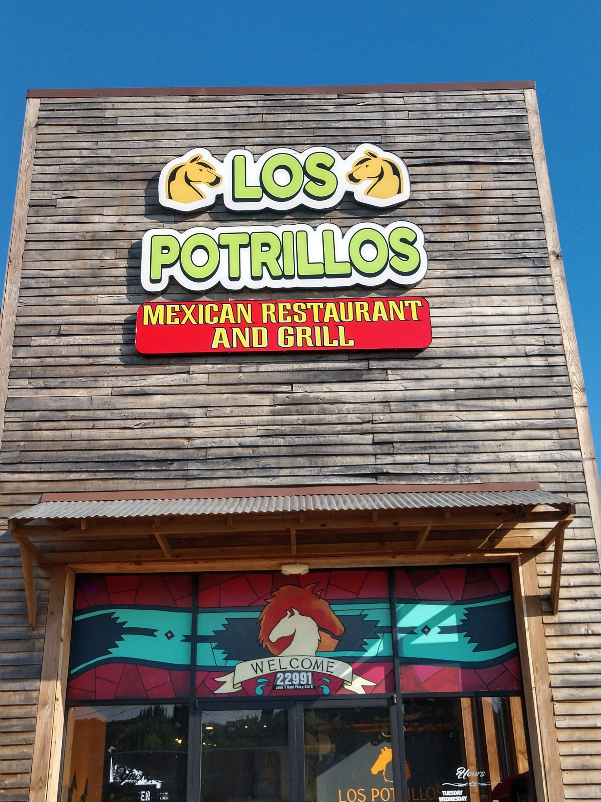 The front of a los potrillos mexican restaurant and grill