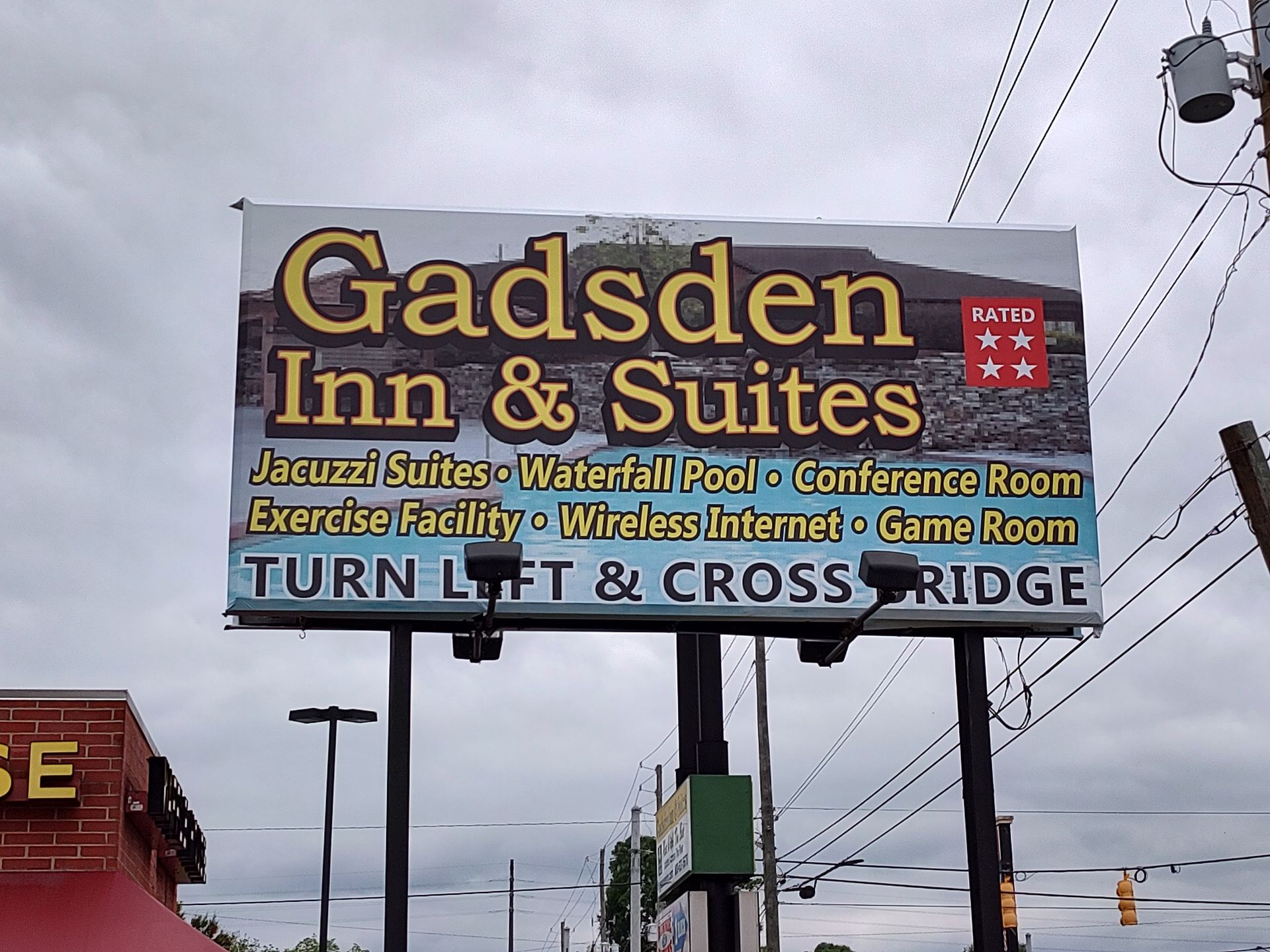 A large billboard for gadsden inn and suites
