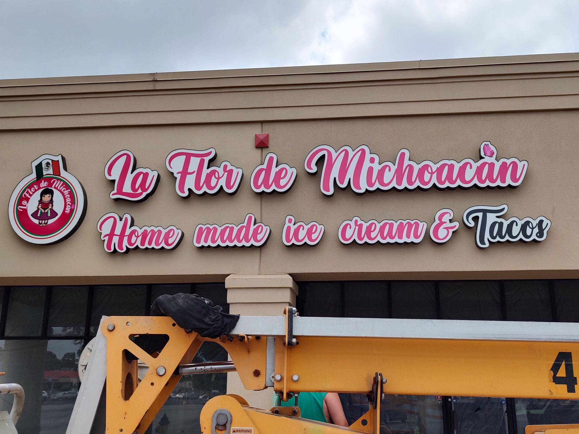 A sign for la flor de michoacan home made ice cream and tacos