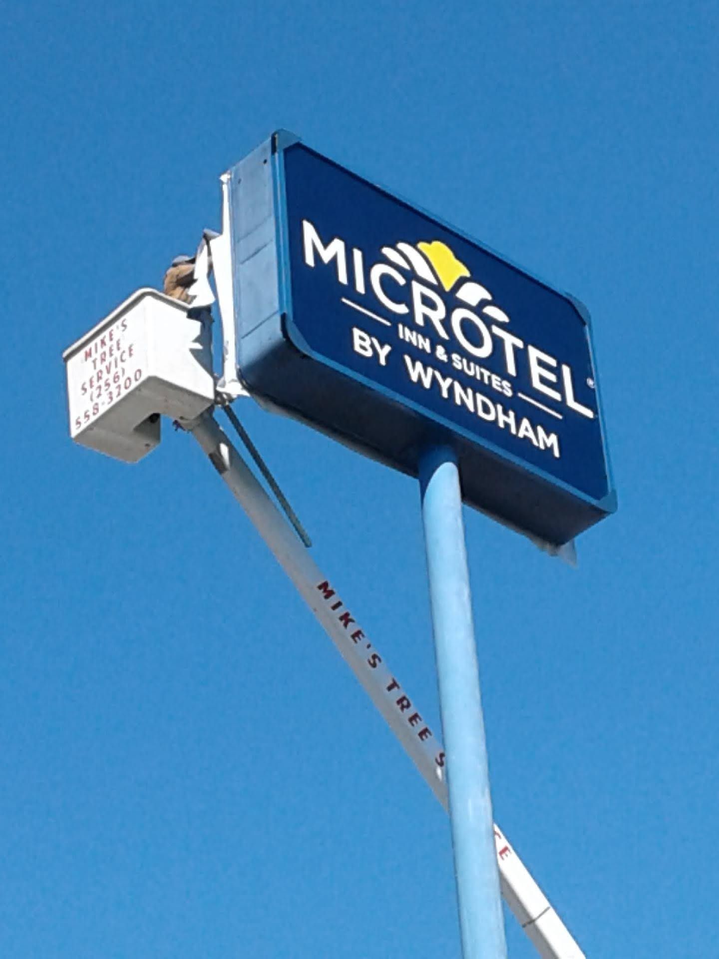 A blue sign that says microtel on it
