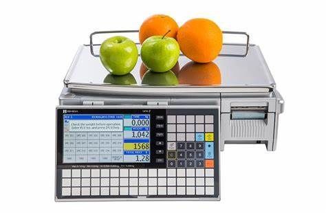 Digital scale with apples and oranges.