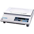 A white laboratory scale with a stainless steel weighing surface and blue buttons.