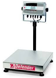 Digital Defender scale with a platform for weighing goods.