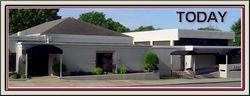 Single-story building with awning and driveway under a blue sky, labeled “TODAY”