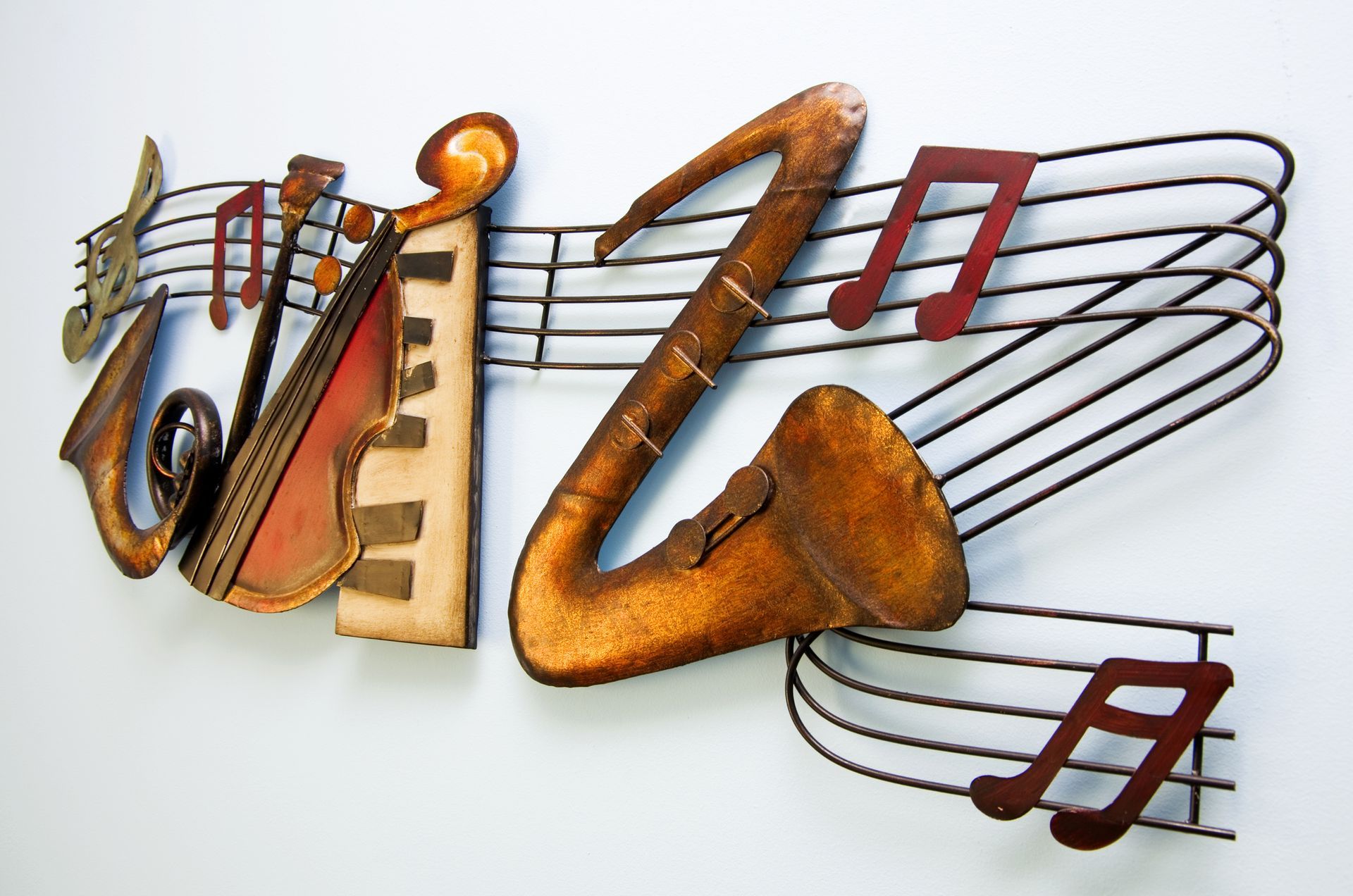 Colorful musical note wall sculpture on a white background
