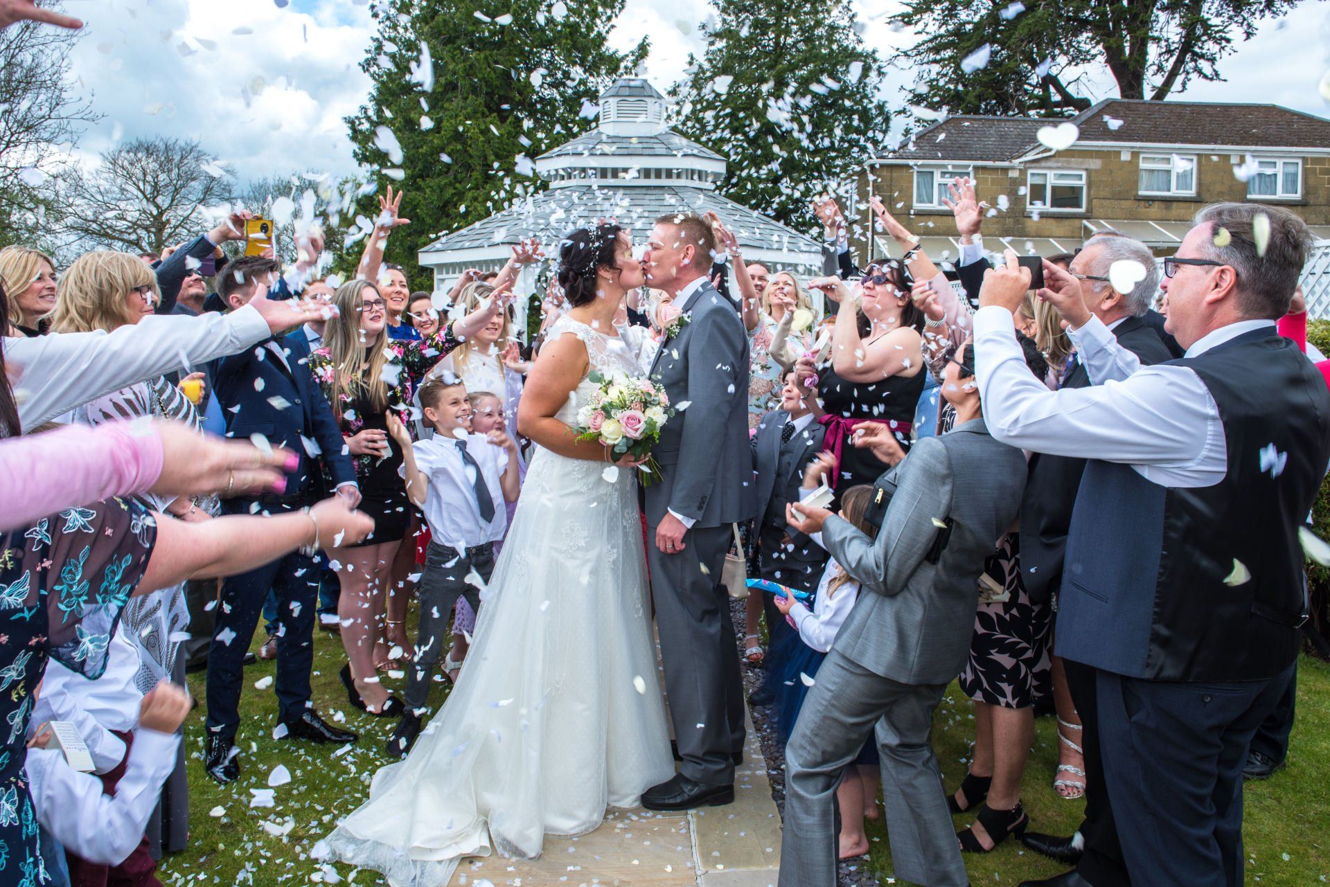 Bride and Groom celebrating their marriage in the wedding gazebo in Ilminster, Somerset
