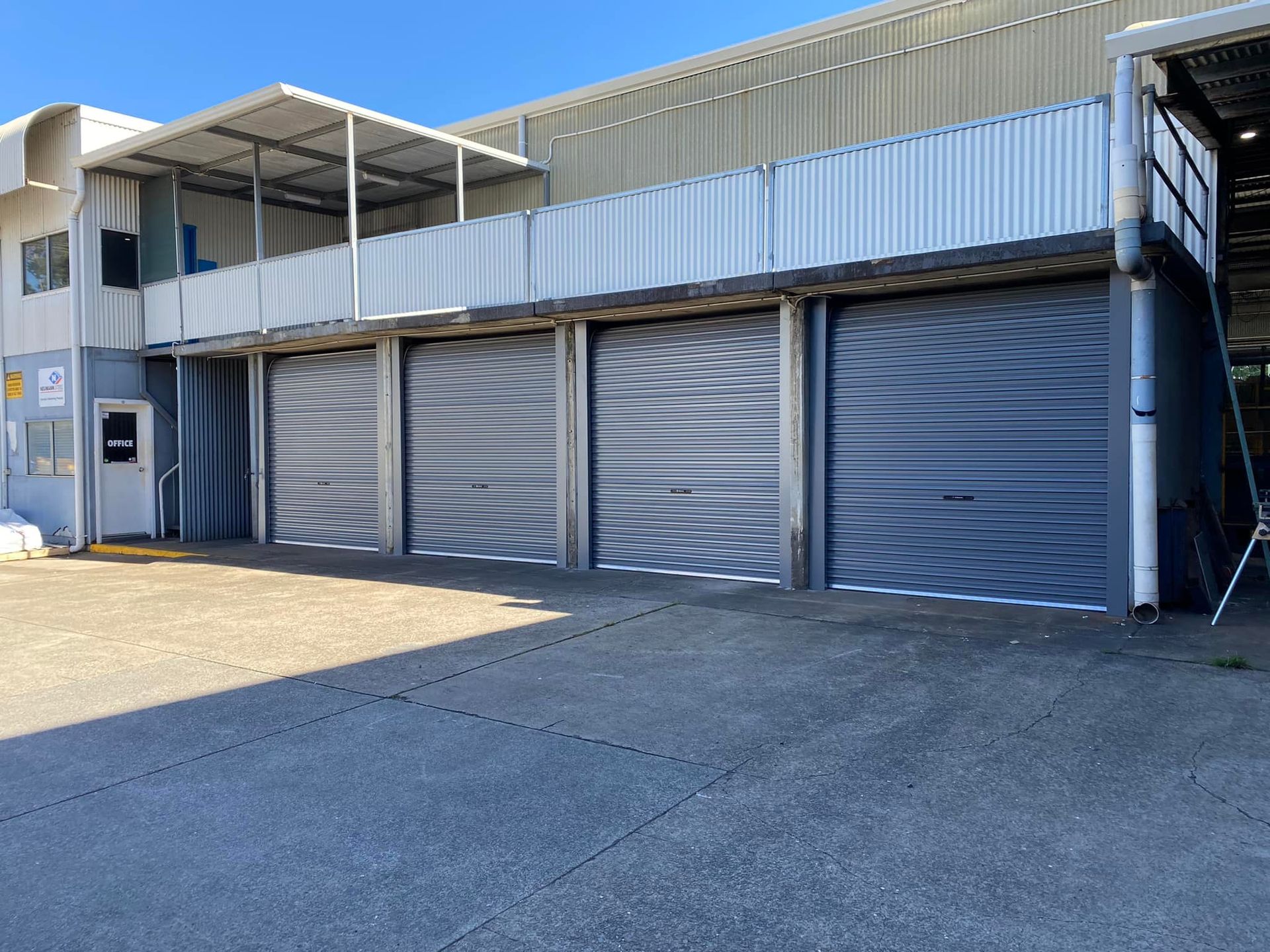 A building with a lot of garage doors on it