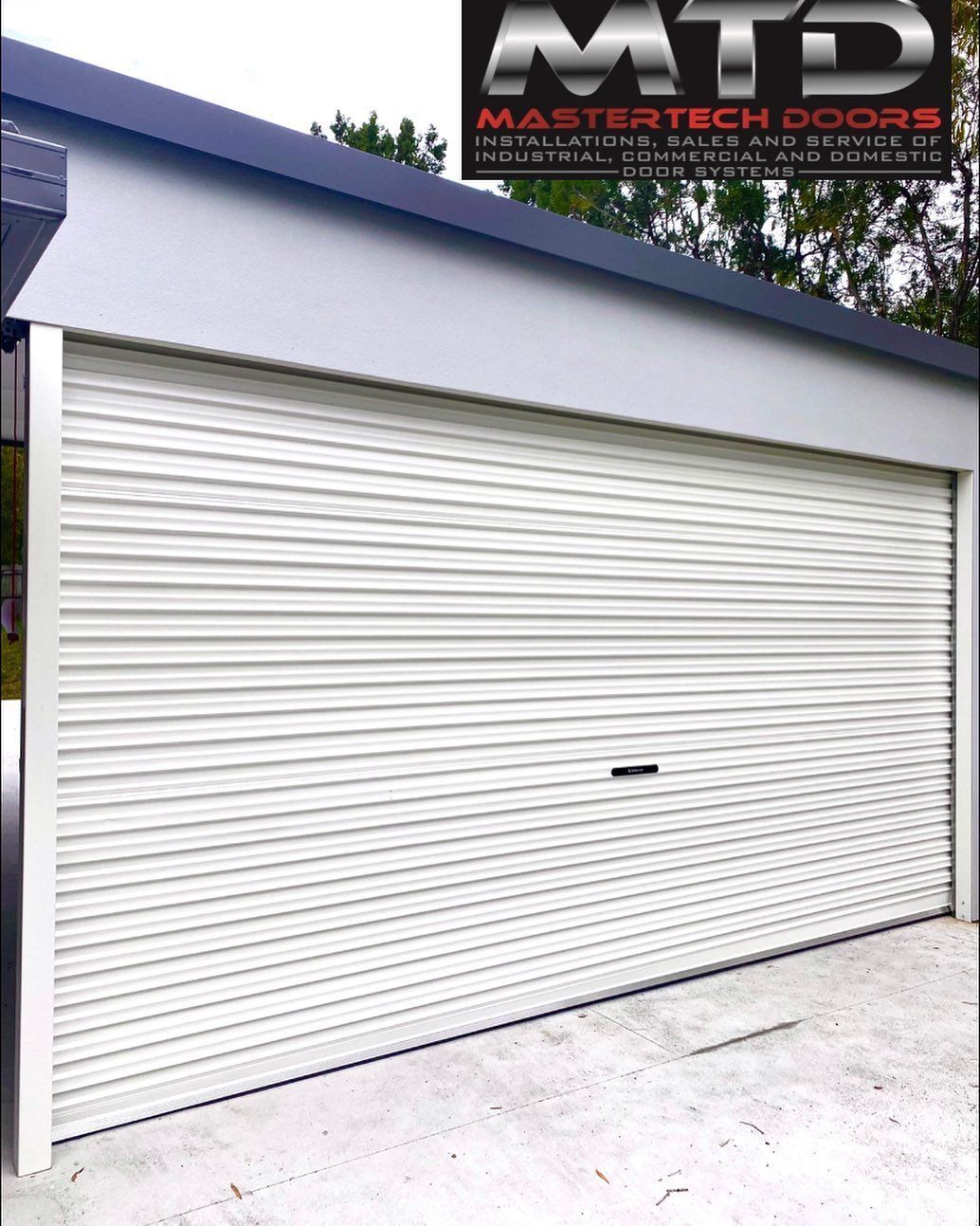 A white garage door with a mtd logo on it