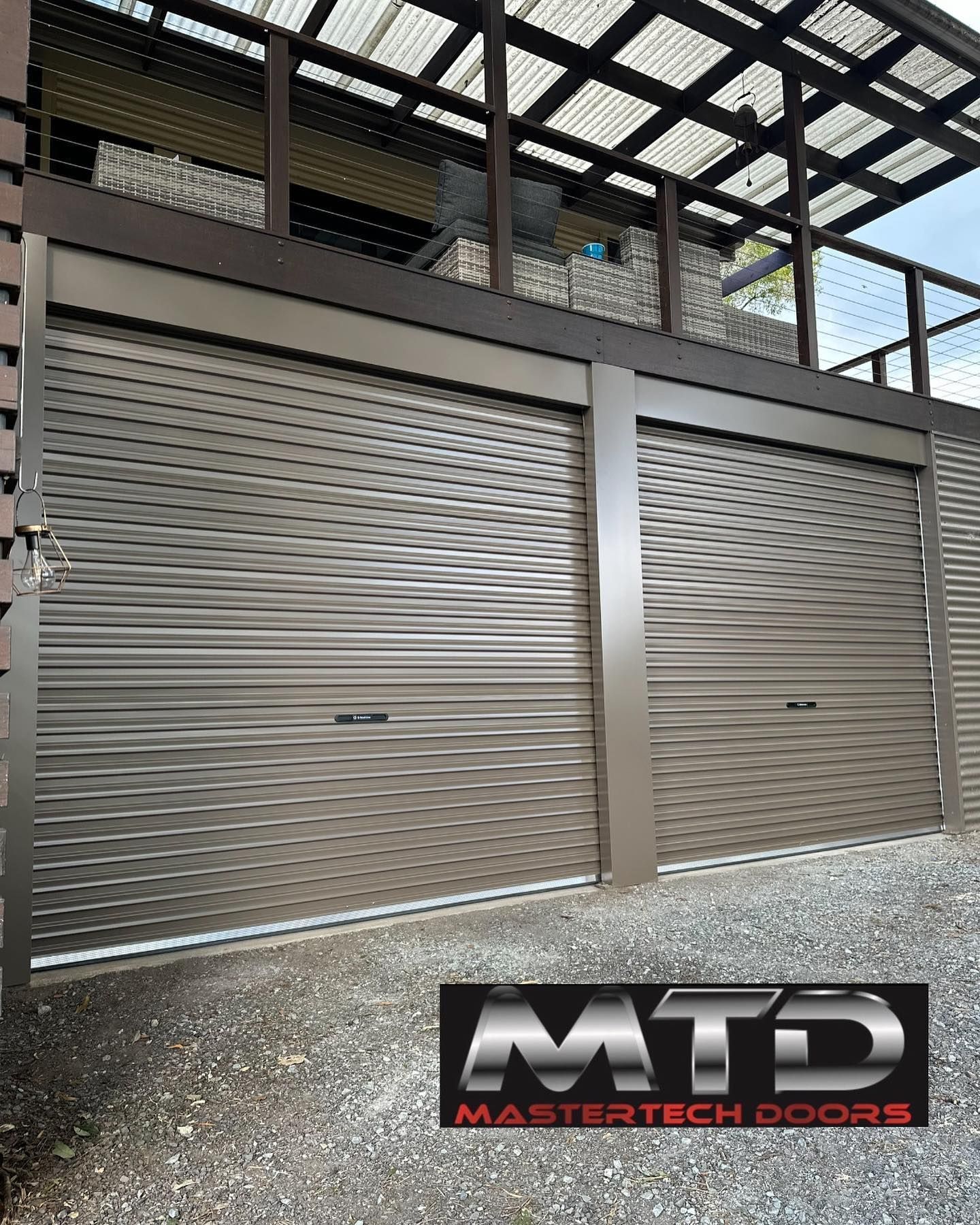 A picture of a garage door with a logo on it.