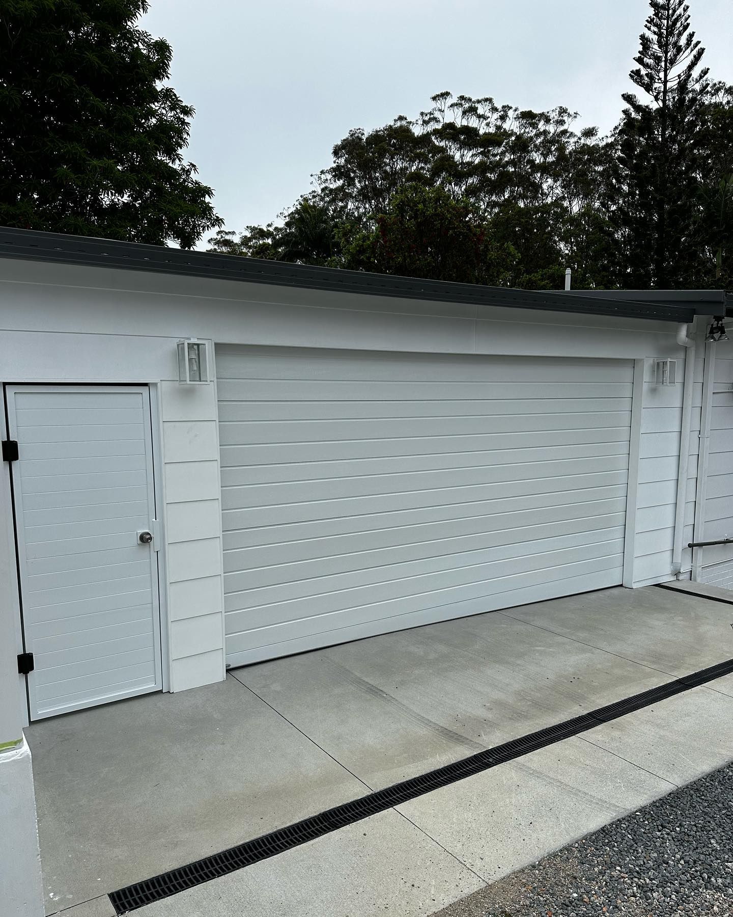 A white garage door with the number 19 on it
