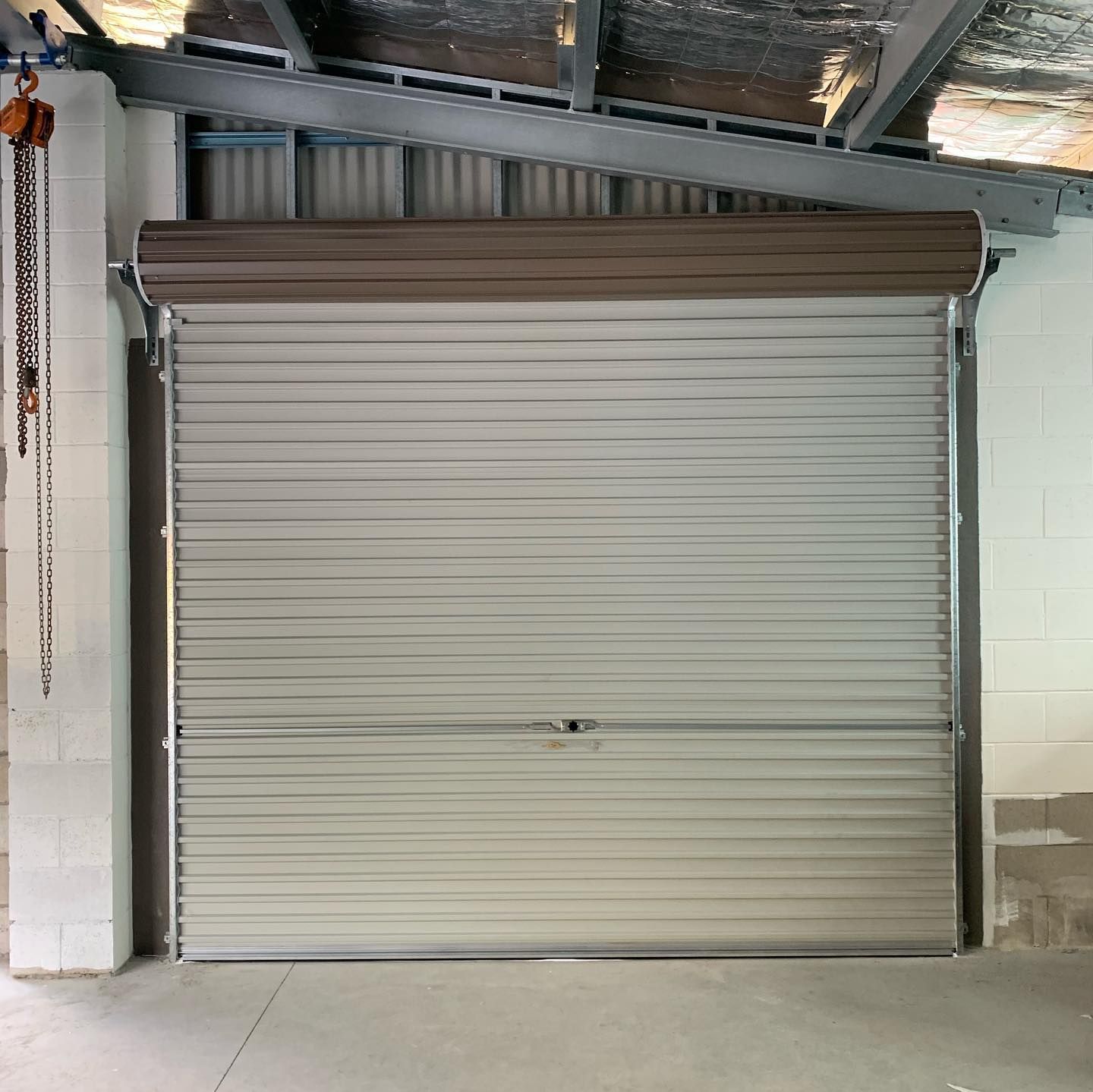 A garage door with a chain attached to it