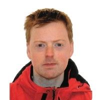 Portrait of a person wearing a red jacket on a white background